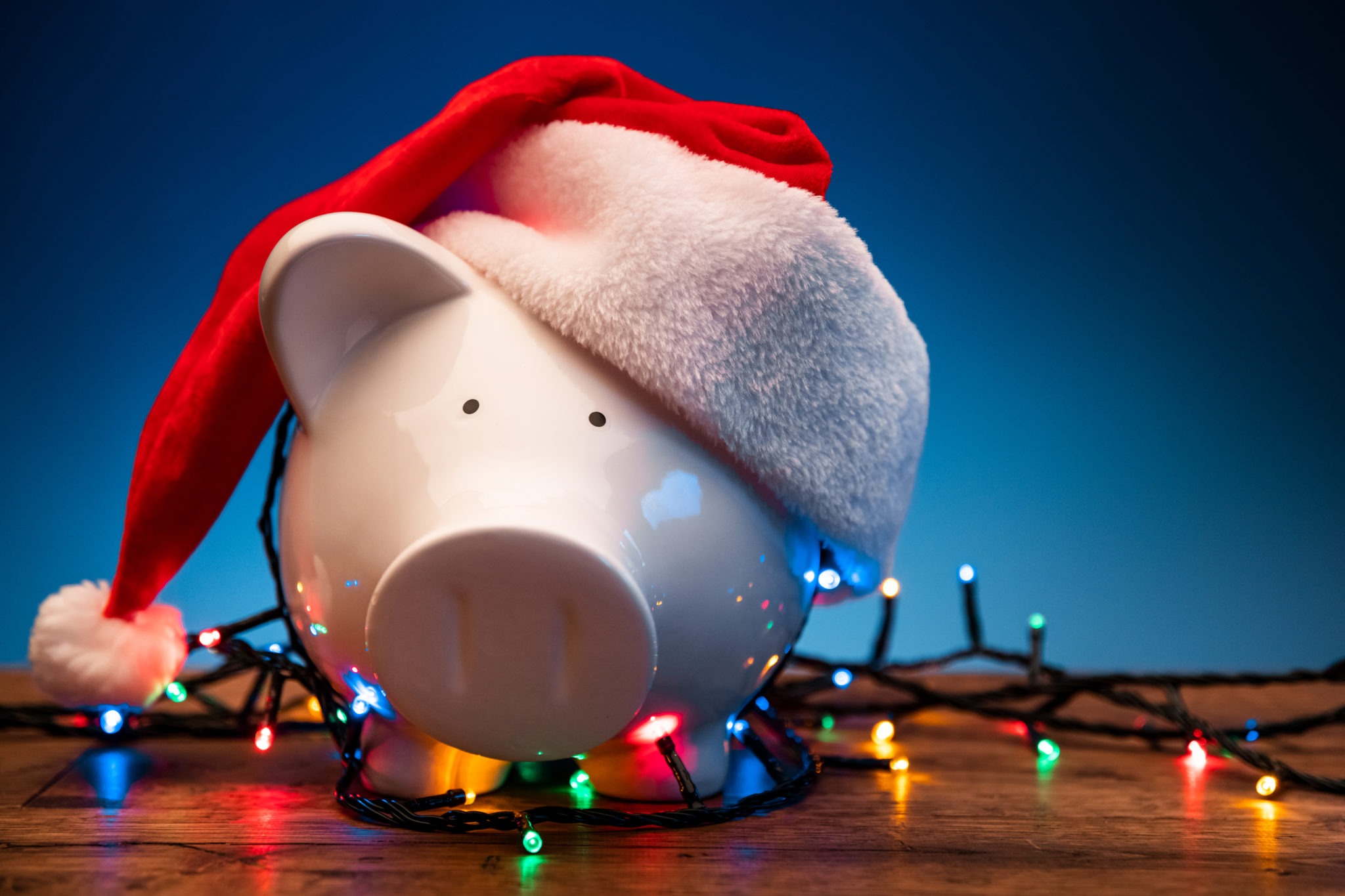 image of piggy bank wearing santa hat