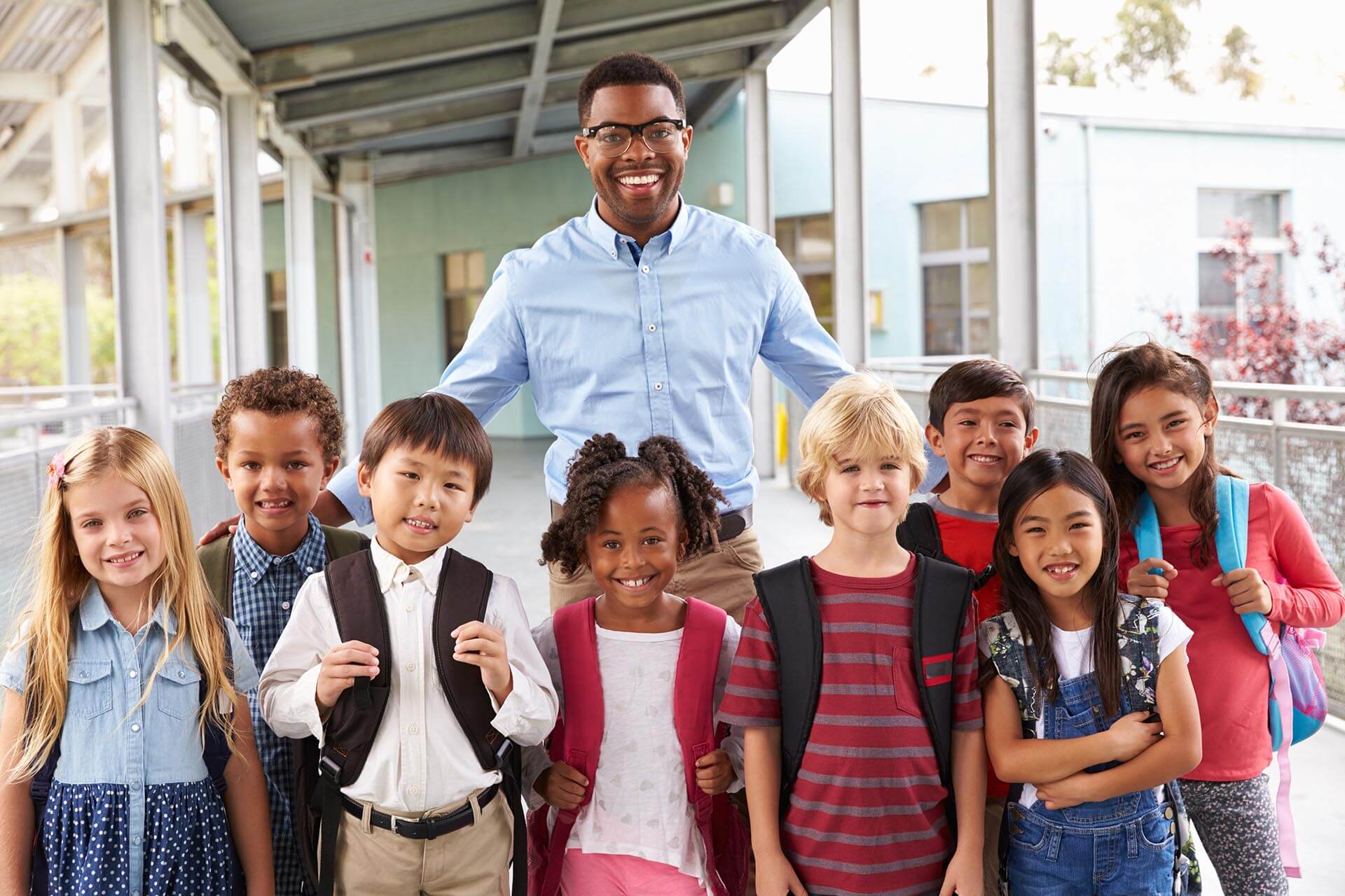 Portrait of teacher with elementary school kids