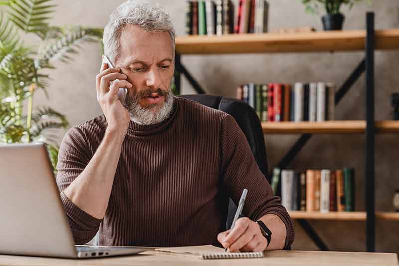 Man-on-Talking-on-Phone Man talking on phone