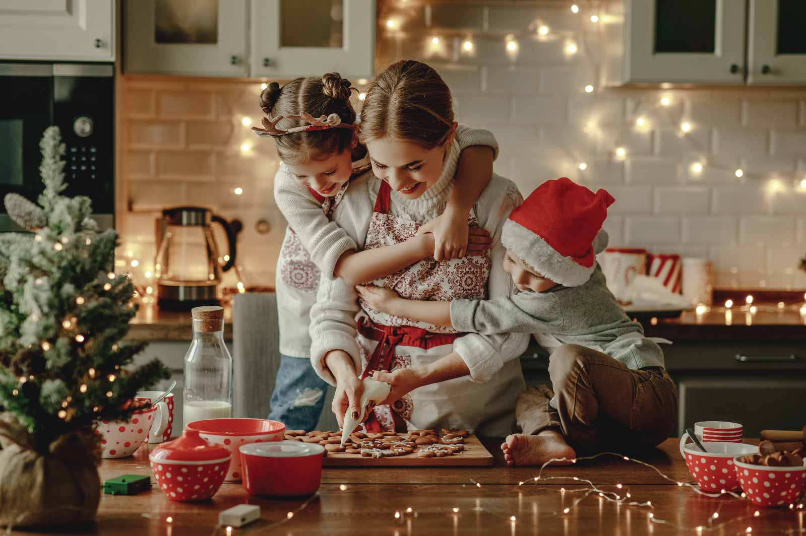 FamilyMakingCookies happy family mother and children bake christmas cookies.