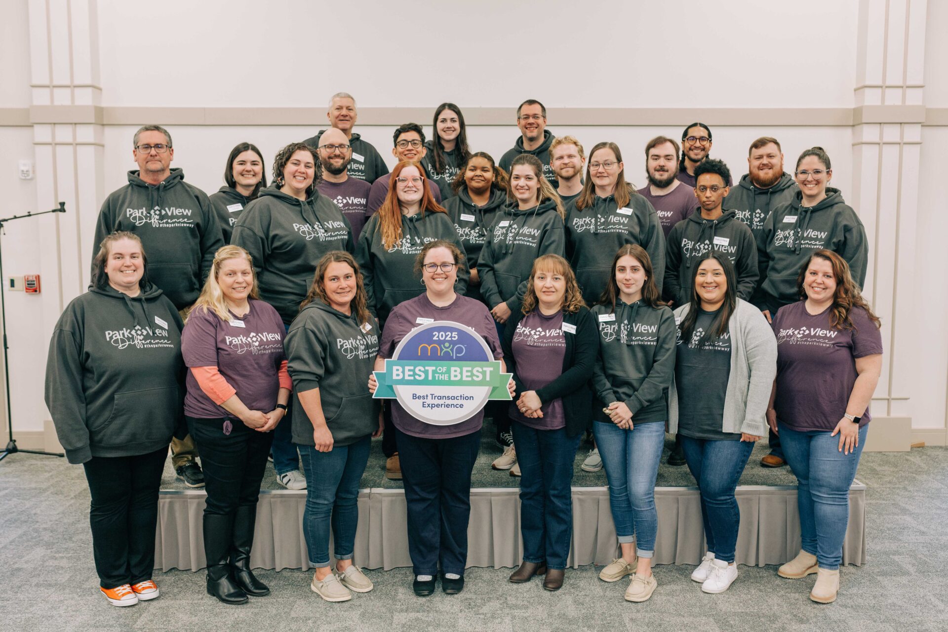 Park View Federal Credit Union staff posing with awards from Member XP's 2025 "Best of the Best" recognition in recognition of the service category, Best Transaction Experience.