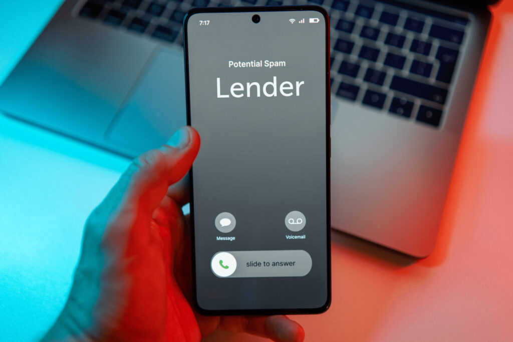 Smartphone screen displaying a "Potential Spam" call alert, representing unsolicited calls from trigger leads after a mortgage application.