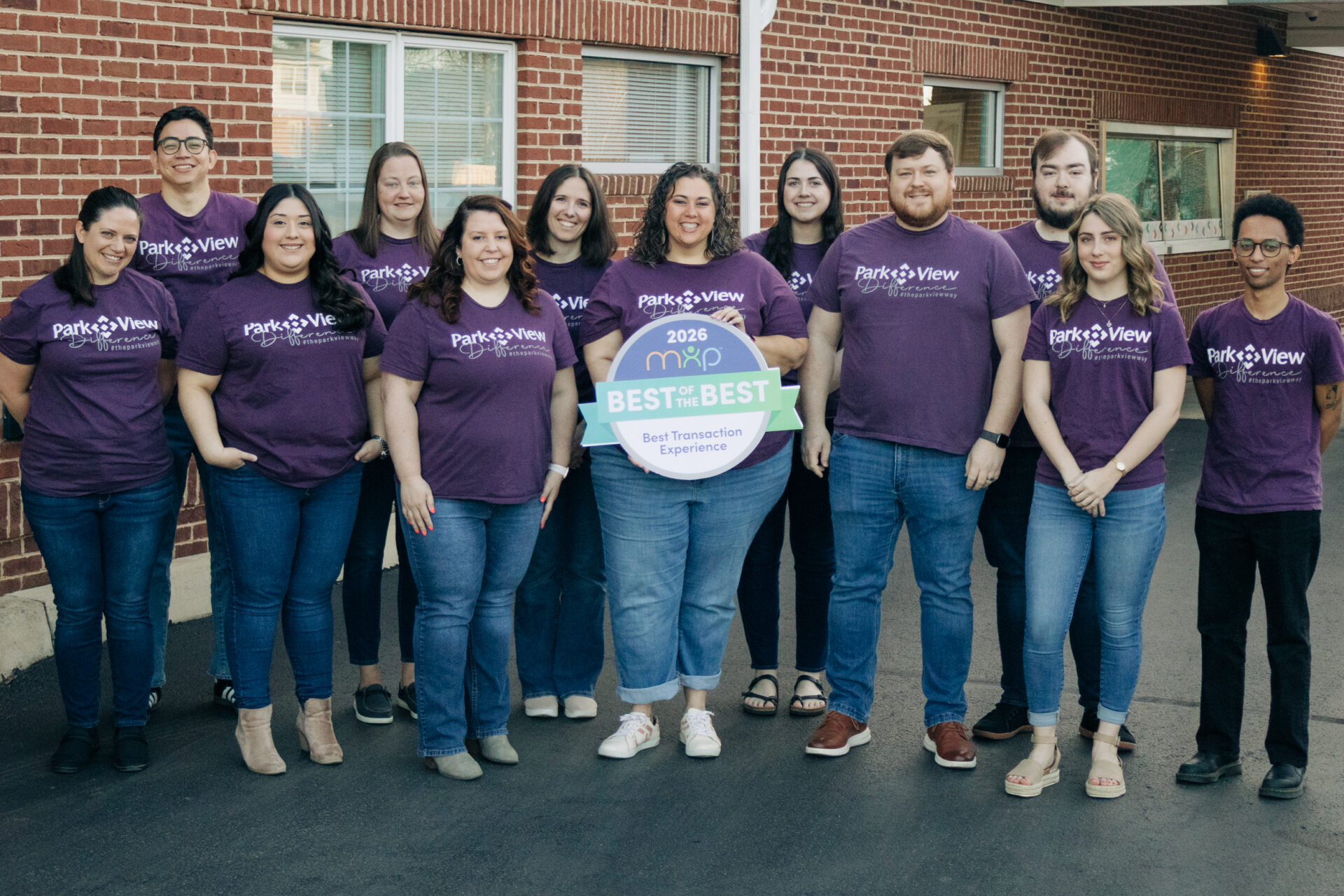 Park View Federal Credit Union staff posing with awards from Member XP's 2026 "Best of the Best" recognition in recognition of the service category, Best Transaction Experience.