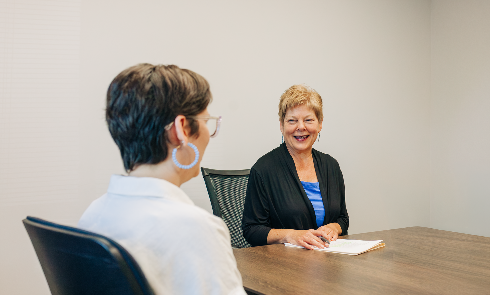 Financial Advsior At Conference Table@0.5x
