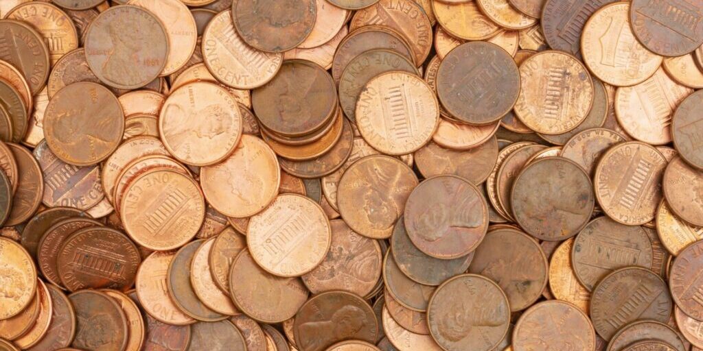 Lots of pennies money background.