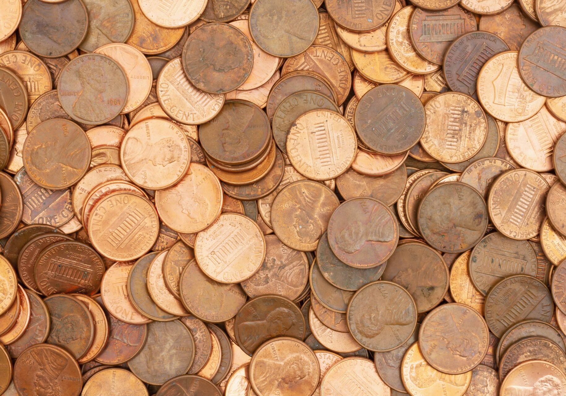 Lots of pennies money background.