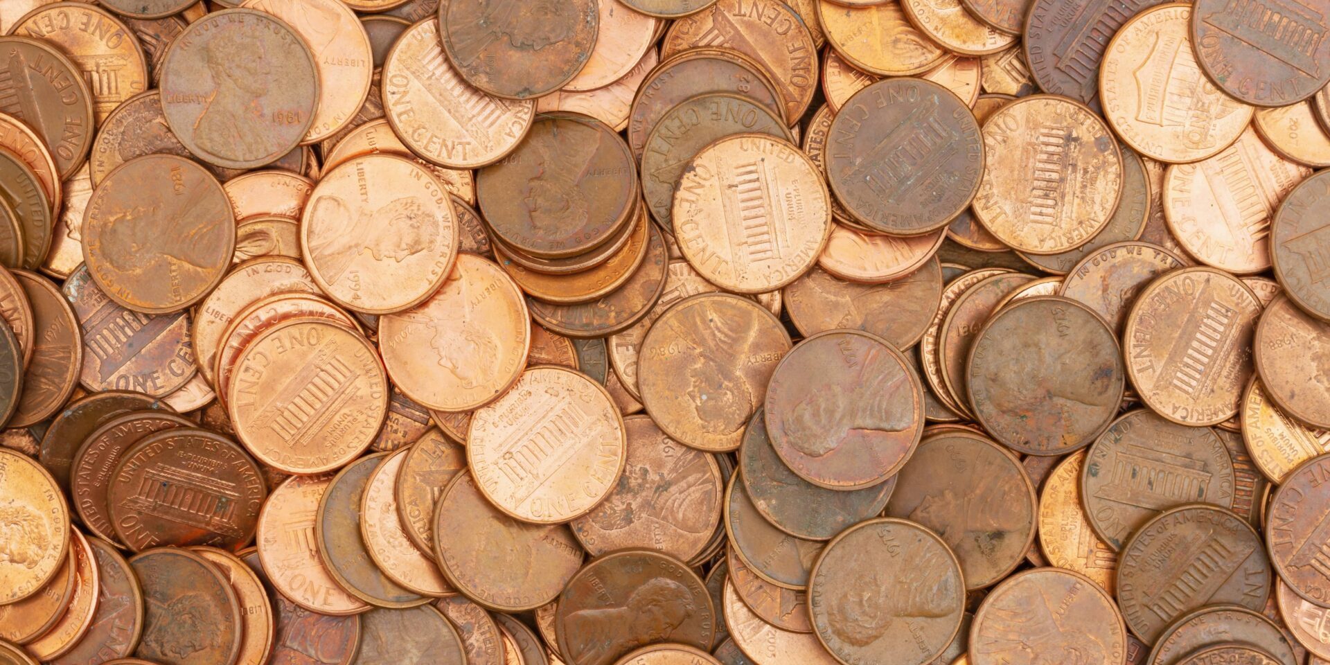 Lots of pennies money background.