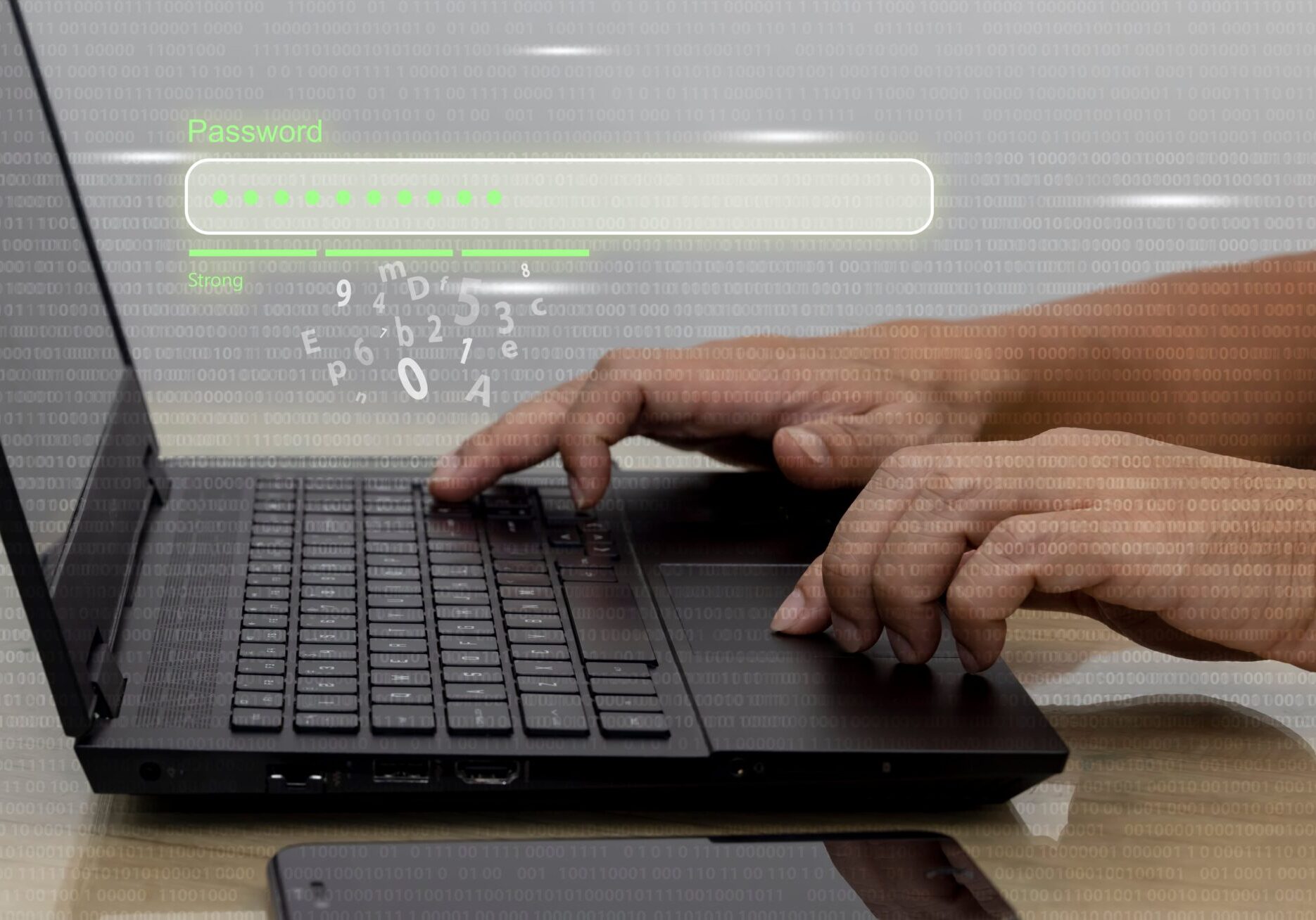A man typing on a laptop with a green screen, focused on creating a secure password.