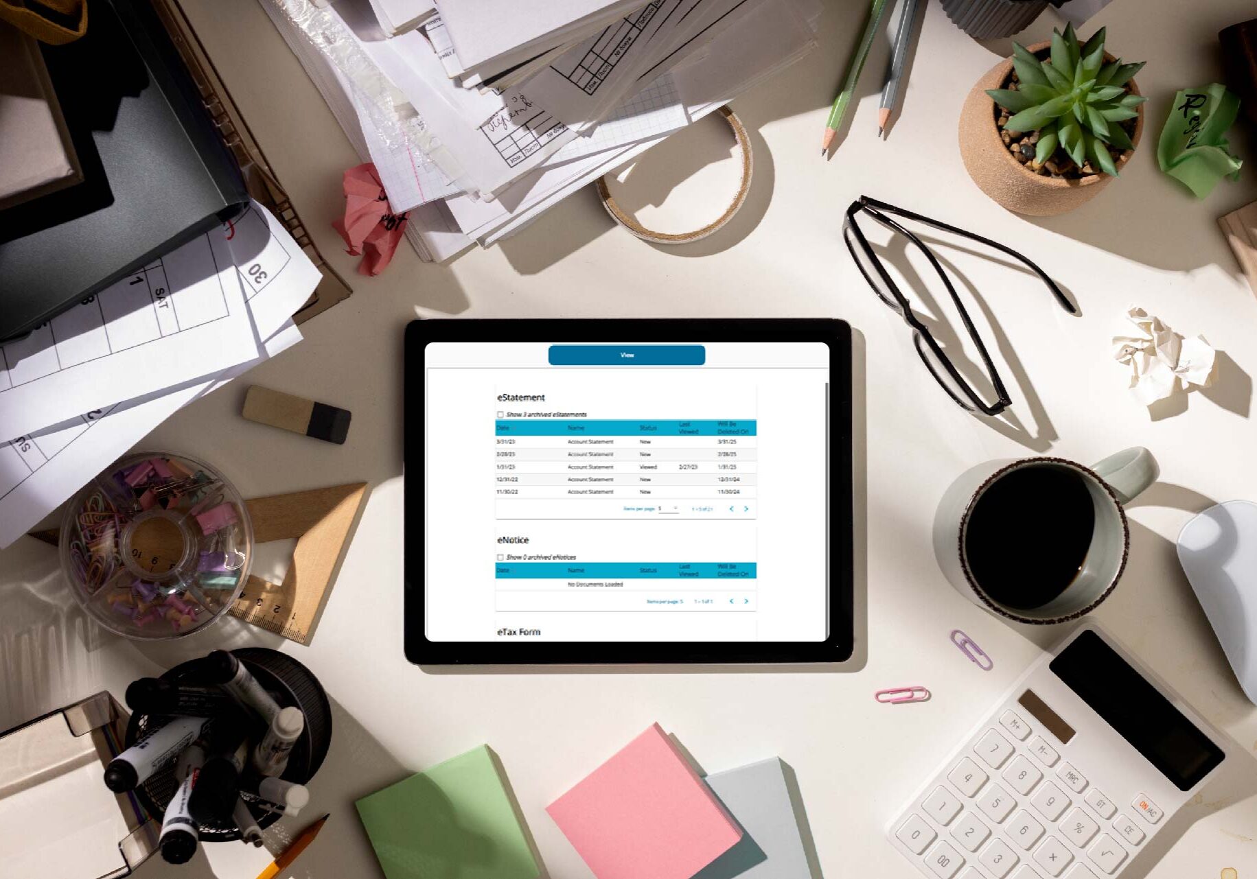 An ipad displaying an estatement on a desk.